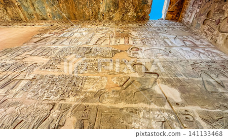 Beautiful bas-reliefs and ancient hieroglyphs from the mortuary temple of Ramesses III at Medinet Habu, Luxor, Egypt. Beautiful bas-reliefs and ancient hieroglyphs from the mortuary temple of Ramesses III at Medinet Habu, Luxor, Egypt. 141133468