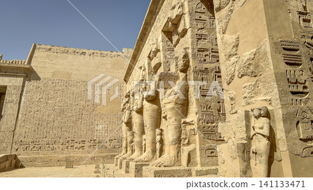 Medinet Habu, the mortuary temple of Ramesses III, located on the west bank of Luxor, Egypt. 141133471