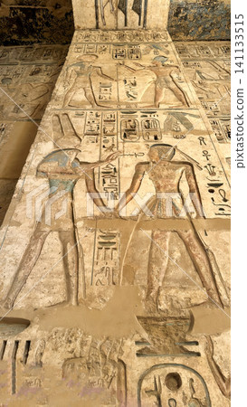 Beautiful bas-reliefs and ancient hieroglyphs from the mortuary temple of Ramesses III at Medinet Habu, Luxor, Egypt. Beautiful bas-reliefs and ancient hieroglyphs from the mortuary temple of Ramesses III at Medinet Habu, Luxor, Egypt. 141133515