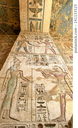 Beautiful bas-reliefs and ancient hieroglyphs from the mortuary temple of Ramesses III at Medinet Habu, Luxor, Egypt. Beautiful bas-reliefs and ancient hieroglyphs from the mortuary temple of Ramesses III at Medinet Habu, Luxor, Egypt. 141133525