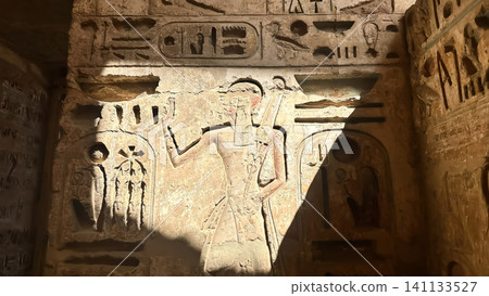 Beautiful bas-reliefs and ancient hieroglyphs from the mortuary temple of Ramesses III at Medinet Habu, Luxor, Egypt. Beautiful bas-reliefs and ancient hieroglyphs from the mortuary temple of Ramesses III at Medinet Habu, Luxor, Egypt. 141133527