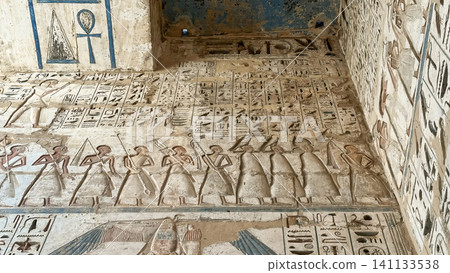 Beautiful bas-reliefs and ancient hieroglyphs from the mortuary temple of Ramesses III at Medinet Habu, Luxor, Egypt. Beautiful bas-reliefs and ancient hieroglyphs from the mortuary temple of Ramesses III at Medinet Habu, Luxor, Egypt. 141133538