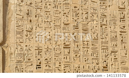 Beautiful bas-reliefs and ancient hieroglyphs from the mortuary temple of Ramesses III at Medinet Habu, Luxor, Egypt. Beautiful bas-reliefs and ancient hieroglyphs from the mortuary temple of Ramesses III at Medinet Habu, Luxor, Egypt. 141133578