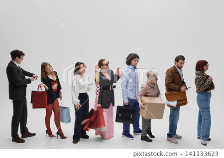 Diverse shoppers and workers waiting in line with purchases and business accessories. Diverse shoppers and workers waiting in line with purchases and business accessories. 141133623