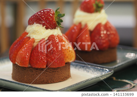Strawberry dessert on a plate in a cafe setting Strawberry dessert on a plate in a cafe setting 141133699