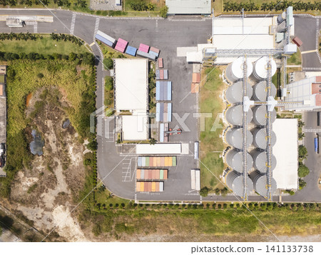 Aerial view of an industrial facility with storage silos and containers Aerial view of an industrial facility with storage silos and containers 141133738