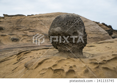 A unique mushroom-shaped rock formation created by erosion in Yehliu Geopark, Taiwan. A unique mushroom-shaped rock formation created by erosion in Yehliu Geopark, Taiwan. 141133745