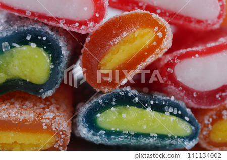 Colorful candy pieces arranged in a pile Colorful candy pieces arranged in a pile 141134002
