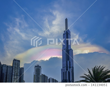 A tall building with a rainbow on top A tall building with a rainbow on top 141134051