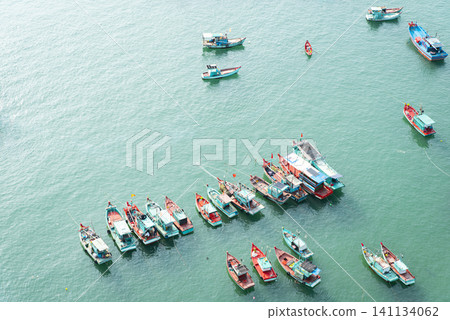 A large body of water with many boats in it 141134062