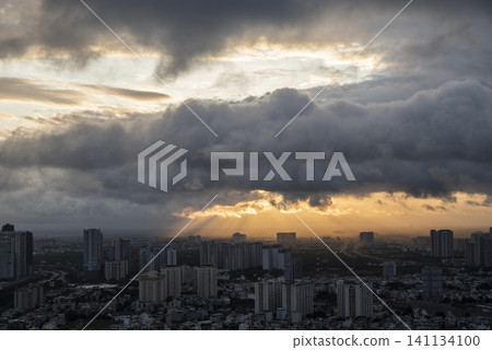 A city skyline with a cloudy sky in the background A city skyline with a cloudy sky in the background 141134100