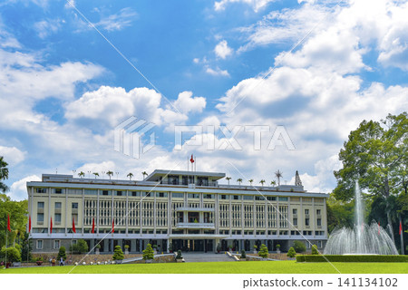 Large building with a fountain in front of it Large building with a fountain in front of it 141134102