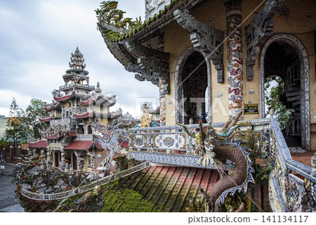 Ornate ceramic mosaic decorations and intricate dragon sculptures at Linh Phuoc Pagoda in Da Lat, Vietnam Ornate ceramic mosaic decorations and intricate dragon sculptures at Linh Phuoc Pagoda in Da Lat, Vietnam 141134117