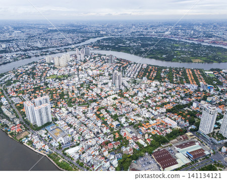 High-angle drone view of Thao Dien district and Saigon River in Ho Chi Minh City, Vietnam. High-angle drone view of Thao Dien district and Saigon River in Ho Chi Minh City, Vietnam. 141134121