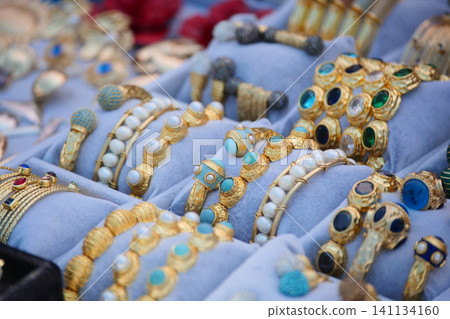 Gold and silver bracelets displayed at a market stall in istanbul Gold and silver bracelets displayed at a market stall in istanbul 141134160