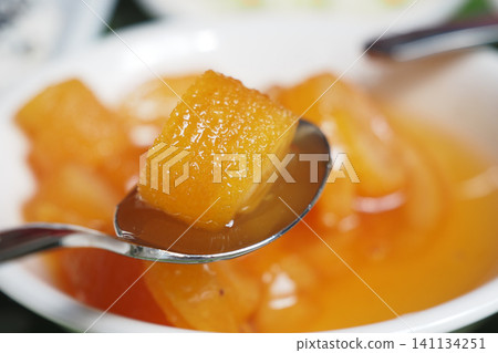 Sweet tropical dessert served in a bowl with spoon Sweet tropical dessert served in a bowl with spoon 141134251
