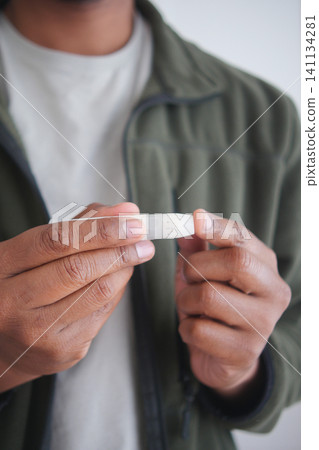 closeup of a man hand measuring diabetic closeup of a man hand measuring diabetic 141134281