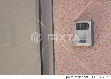 Video doorbell mounted on exterior wall of home 141134284