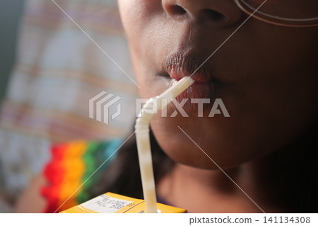 Enjoying a refreshing drink on a warm day Enjoying a refreshing drink on a warm day 141134308