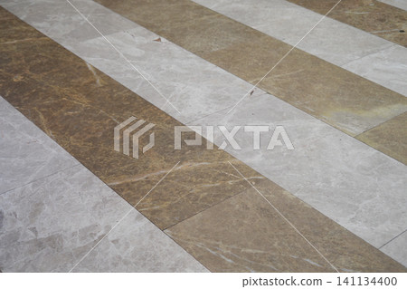 Elegant marble flooring in a polished public space Elegant marble flooring in a polished public space 141134400
