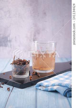 clove water or clove tea, a beverage made by infusing dried clove buds in hot water clove water or clove tea, a beverage made by infusing dried clove buds in hot water 141134424