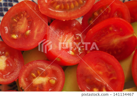Fresh cut tomatoes ready for a healthy meal preparation Fresh cut tomatoes ready for a healthy meal preparation 141134467