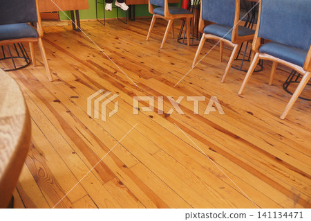 Wooden floor with stylish chairs in a cozy space 141134471