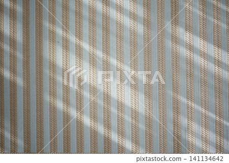 Sunlight creates a striking pattern on a carpet . Sunlight creates a striking pattern on a carpet . 141134642