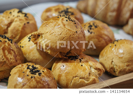 Freshly baked rolls on a tray at a bakery shop Freshly baked rolls on a tray at a bakery shop 141134654