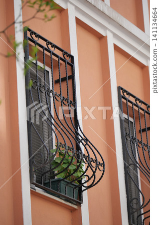 Wrought iron balcony design with urban greenery Wrought iron balcony design with urban greenery 141134664