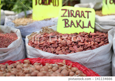 Colorful variety of beans at local market stall in daylight Colorful variety of beans at local market stall in daylight 141134666