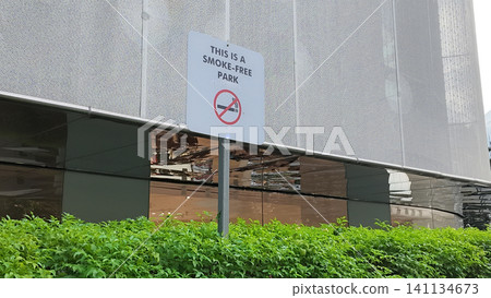 Smoke-free park sign near building in urban area Smoke-free park sign near building in urban area 141134673