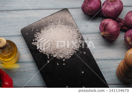 Cooking ingredients are arranged on a kitchen table Cooking ingredients are arranged on a kitchen table 141134679