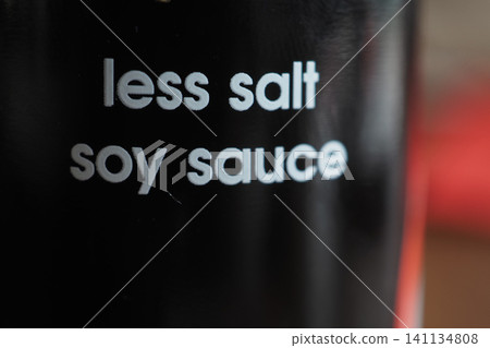 Soy sauce bottle with less salt label in focus Soy sauce bottle with less salt label in focus 141134808