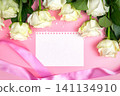 beautiful white roses on a pink background. place for text. top view background 141134910