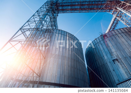 Modern silos for storing grain harvest. Agriculture. Modern silos for storing grain harvest. Agriculture. 141135084