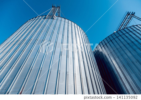 Modern silos for storing grain harvest. Agriculture. Modern silos for storing grain harvest. Agriculture. 141135092