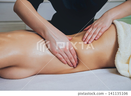 Young girl is relaxing in the spa. Young girl is relaxing in the spa. 141135106