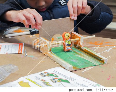 Little child making and painting a wooden soccer toy craft at Home Depot kids workshop - June 6, 2026 Federal Way WA, USA Little child making and painting a wooden soccer toy craft at Home Depot kids workshop - June 6, 2026 Federal Way WA, USA 141135206