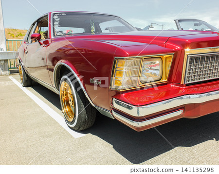 Close-up of a red Chevrolet Monte Carlo with gold rims car show in Ruston - June 13, 2026 Ruston WA, USA Close-up of a red Chevrolet Monte Carlo with gold rims car show in Ruston - June 13, 2026 Ruston WA, USA 141135298