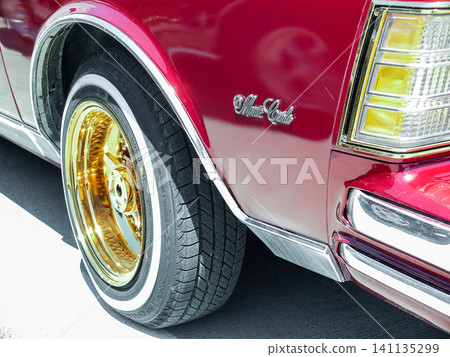 Close-up of a red Chevrolet Monte Carlo with gold rims car show in Ruston - June 13, 2026 Ruston WA, USA Close-up of a red Chevrolet Monte Carlo with gold rims car show in Ruston - June 13, 2026 Ruston WA, USA 141135299
