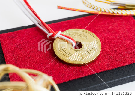 Good fortune, matchmaking, a five-yen coin with a red string Good fortune, matchmaking, a five-yen coin with a red string 141135326