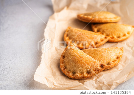 Traditional baked Spanish empanadas Traditional baked Spanish empanadas 141135394