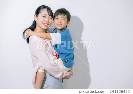 A mother holding a child A mother holding a child 141136433