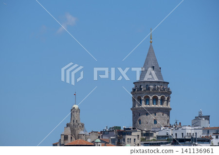 Galata Tower Rising Between Historic Buildings in Istanbul.  141136961