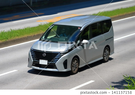 Image of a minivan in motion Image of a minivan in motion 141137158