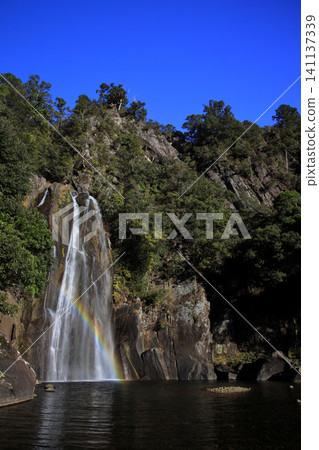 A rainbow reflected in a waterfall of flying snow. A rainbow reflected in a waterfall of flying snow. 141137339