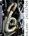 The exhaust manifold/exhaust pipe of a horizontally opposed engine has been wrapped in heat-resistant (thermo-bandage) to improve exhaust efficiency. 141137404