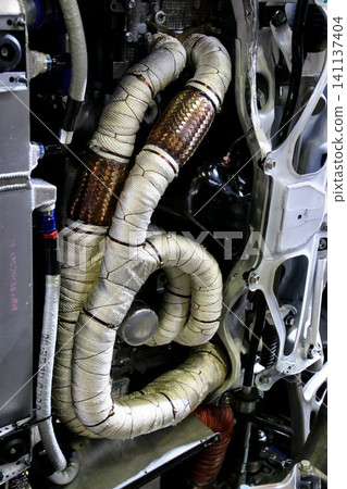 The exhaust manifold/exhaust pipe of a horizontally opposed engine has been wrapped in heat-resistant (thermo-bandage) to improve exhaust efficiency. The exhaust manifold/exhaust pipe of a horizontally opposed engine has been wrapped in heat-resistant (thermo-bandage) to improve exhaust efficiency. 141137404