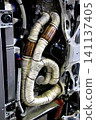 The exhaust manifold/exhaust pipe of a horizontally opposed engine has been wrapped in heat-resistant (thermo-bandage) to improve exhaust efficiency. 141137405